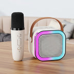 Portable karaoke machine with microphone on a table.