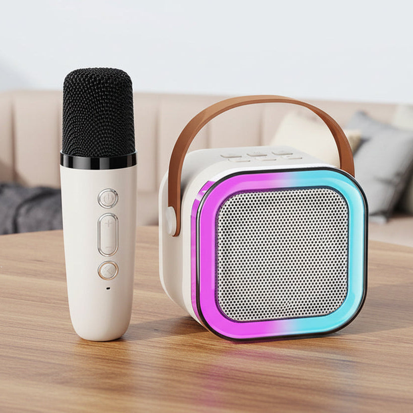 Portable karaoke machine with microphone on a table.
