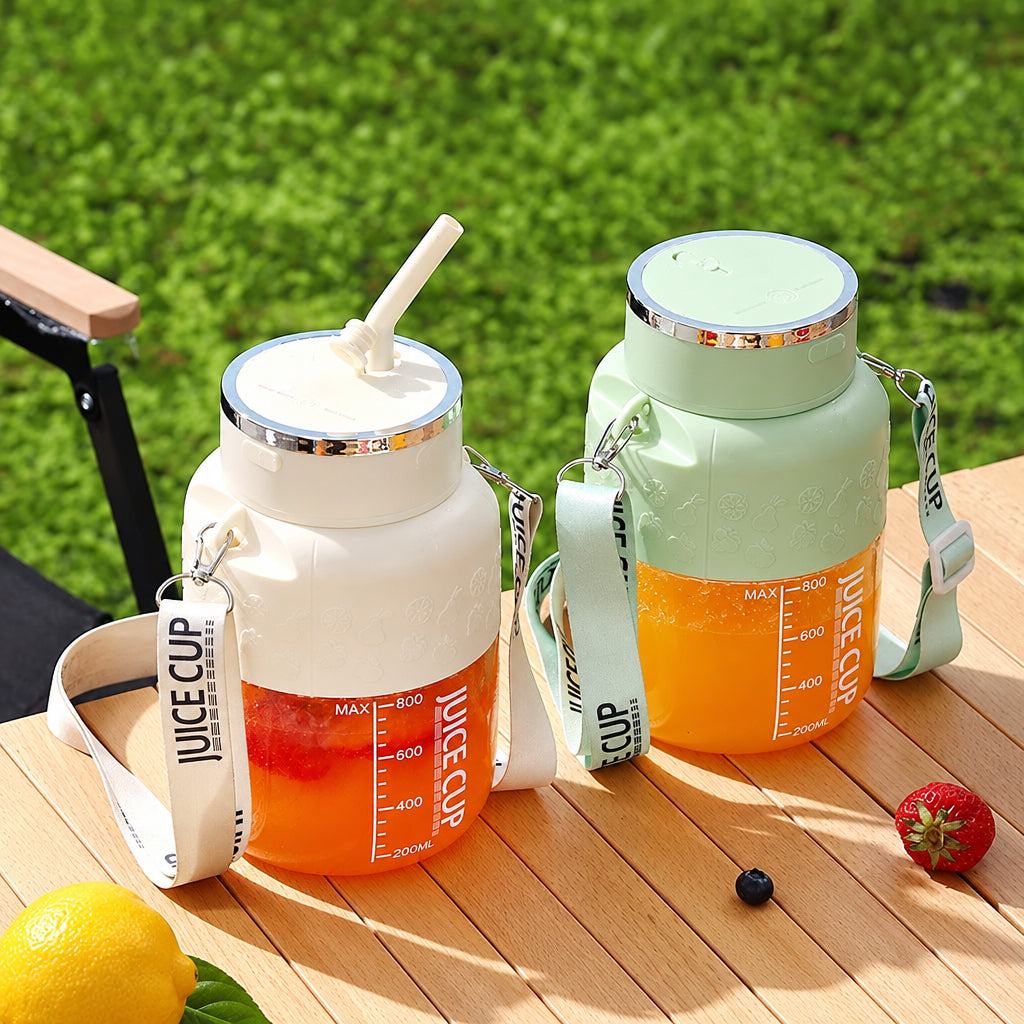 Two juice cups with straws on a wooden surface outdoors