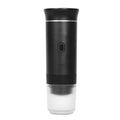 A portable electric coffee grinder with a matte black body, a textured grip, a clear plastic container at the bottom, and a silver accent ring, shown on a solid white background.