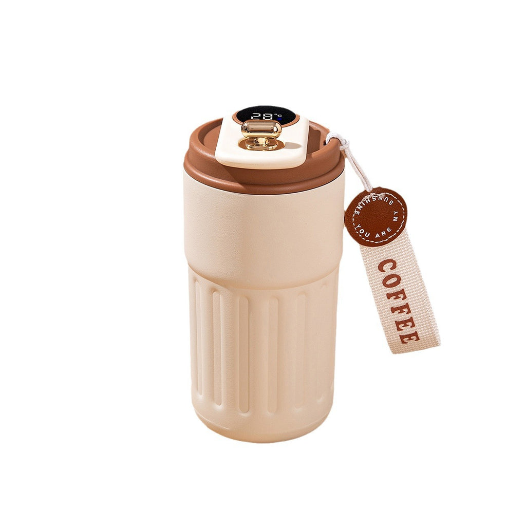 Beige coffee tumbler with brown lid and 'COFFEE' tag on a white background